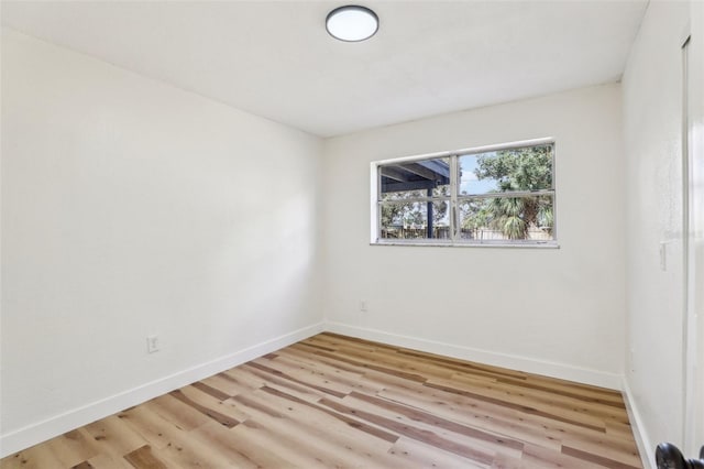 spare room featuring light hardwood / wood-style floors