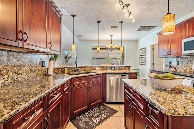 kitchen featuring backsplash, stainless steel dishwasher, a textured ceiling, sink, and pendant lighting