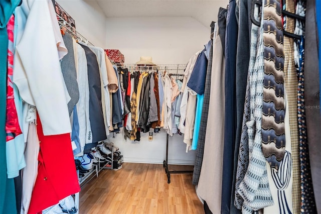 walk in closet featuring hardwood / wood-style floors