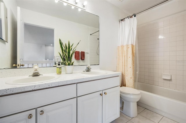 full bathroom with tile patterned flooring, vanity, toilet, and shower / bath combo with shower curtain