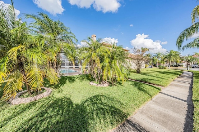 view of yard featuring a lanai