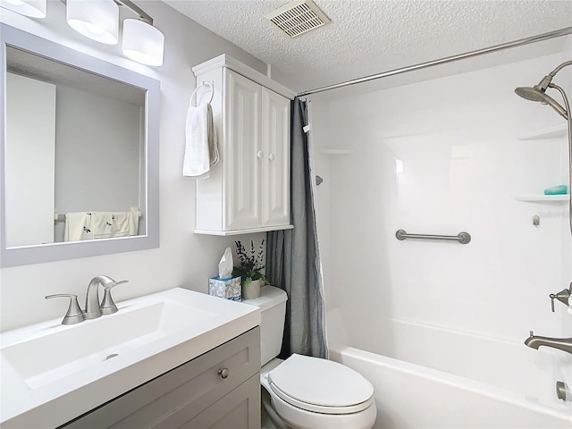 full bathroom featuring vanity, shower / tub combo, a textured ceiling, and toilet