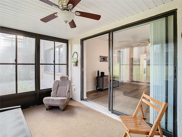 sunroom featuring a wealth of natural light and ceiling fan