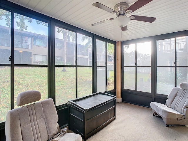 sunroom / solarium featuring ceiling fan