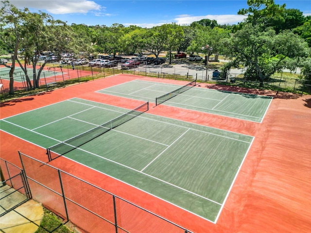 view of tennis court featuring basketball court