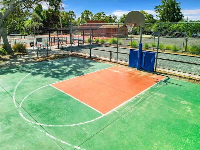 view of sport court featuring tennis court