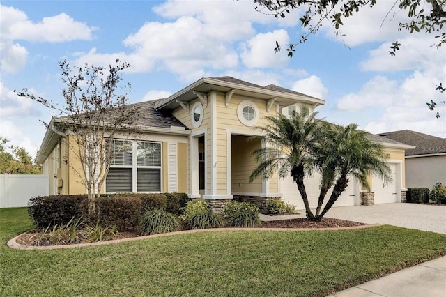 view of front facade with a front lawn and a garage