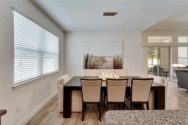 dining space featuring light hardwood / wood-style flooring