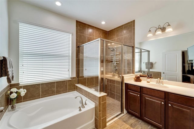 bathroom with plus walk in shower and vanity