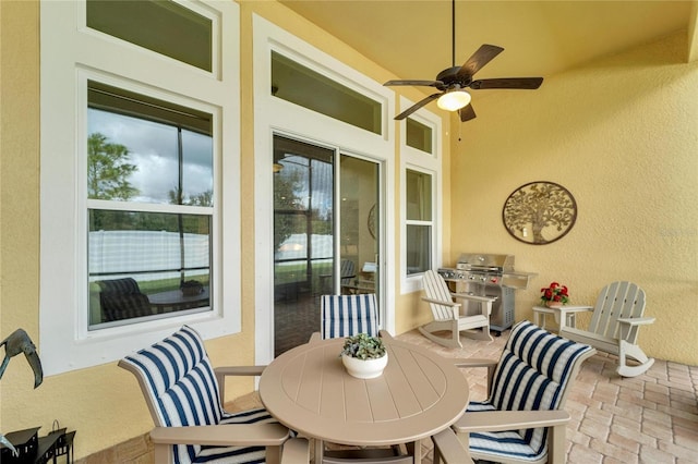 view of patio / terrace featuring ceiling fan and a grill