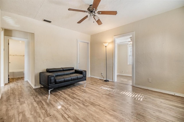 sitting room featuring hardwood / wood-style flooring and ceiling fan