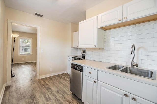 kitchen featuring dishwasher, sink, light hardwood / wood-style flooring, decorative backsplash, and white cabinetry