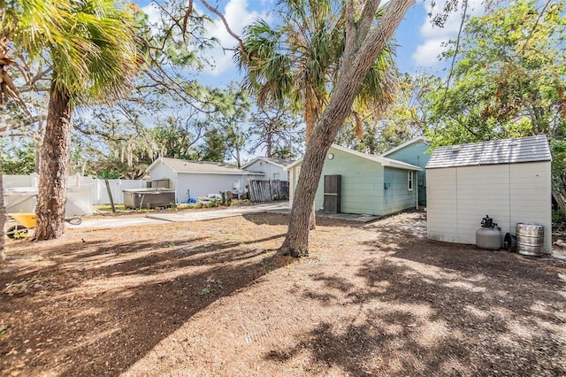 view of yard with a storage unit