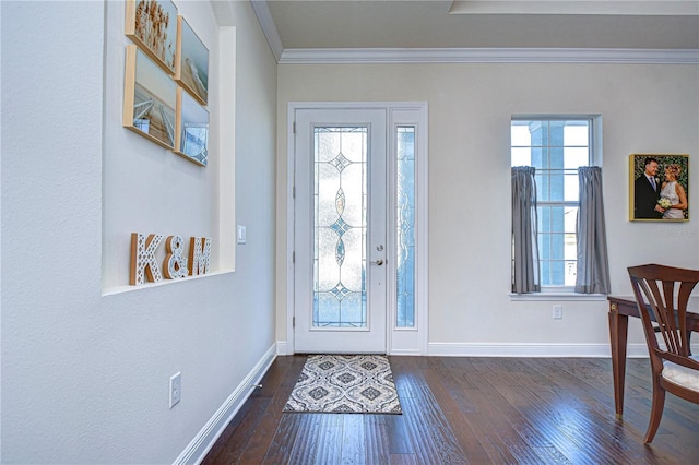 entryway with dark hardwood / wood-style flooring and crown molding