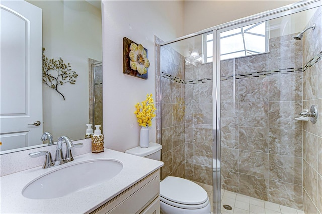 bathroom featuring vanity, toilet, and walk in shower