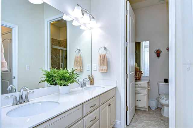 bathroom with vanity, toilet, and walk in shower