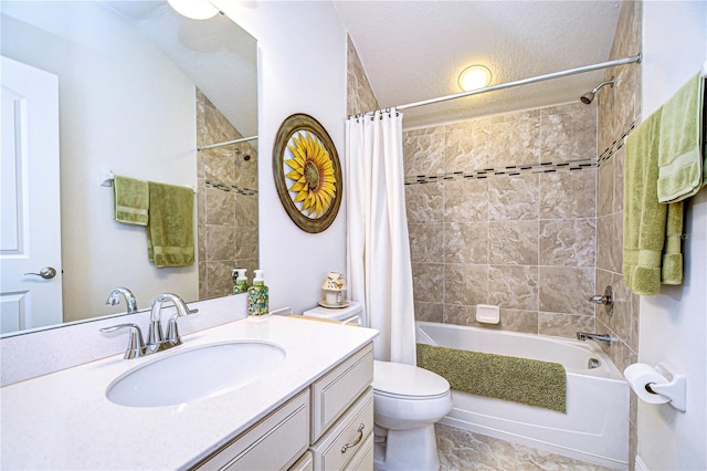 full bathroom with vanity, toilet, shower / bath combo with shower curtain, and a textured ceiling