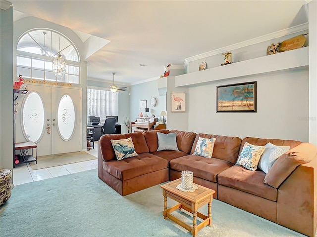 living room with ceiling fan, ornamental molding, light carpet, and french doors