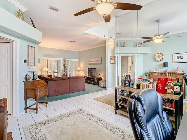 tiled living room featuring ceiling fan and ornamental molding