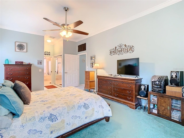 bedroom with ceiling fan, carpet floors, crown molding, and ensuite bath