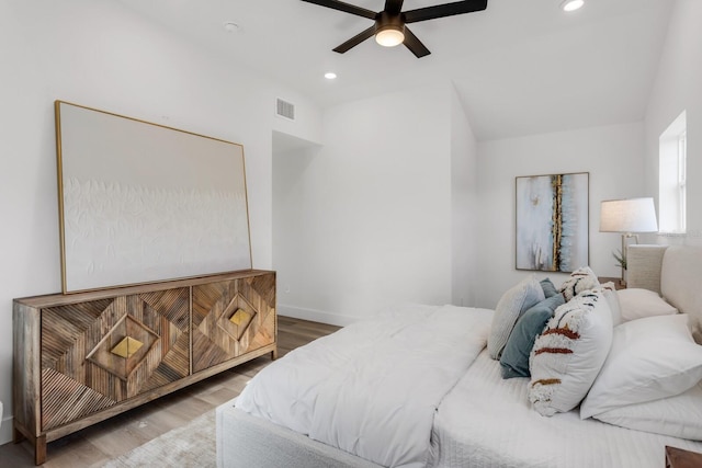 bedroom featuring hardwood / wood-style floors and ceiling fan