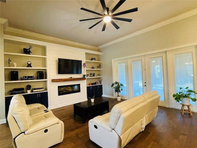 living room featuring dark hardwood / wood-style floors, ceiling fan, crown molding, and built in shelves