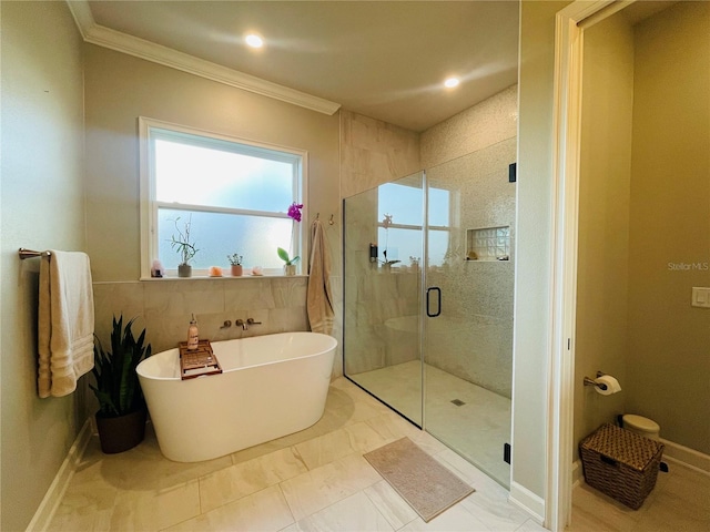 bathroom featuring plus walk in shower, tile patterned floors, and crown molding