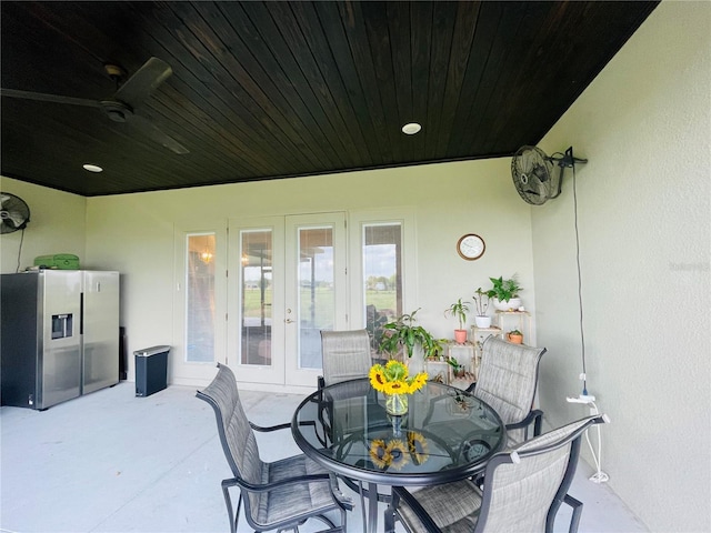 view of patio / terrace featuring ceiling fan and french doors