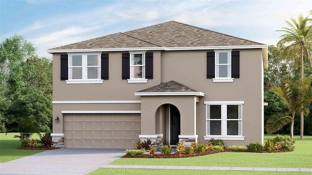 view of front of house featuring a front yard and a garage