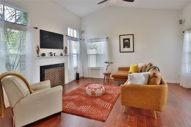 living room featuring ceiling fan, wood-type flooring, and high vaulted ceiling