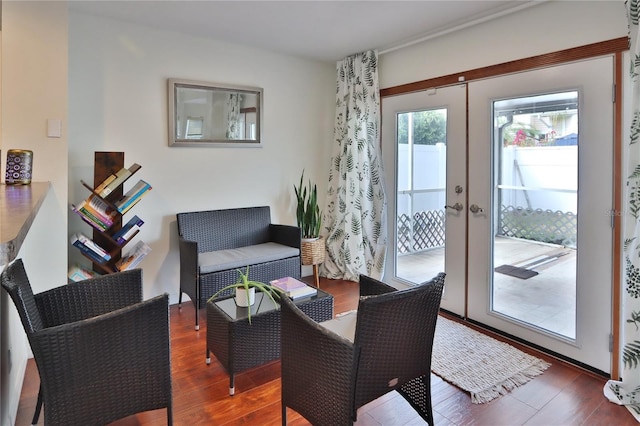 living area featuring hardwood / wood-style floors and french doors