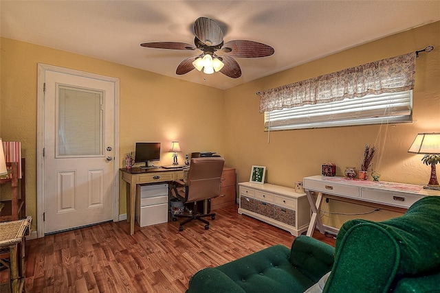 office space with hardwood / wood-style flooring and ceiling fan