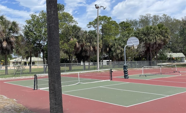 view of basketball court featuring tennis court