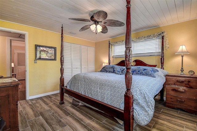 bedroom with wood ceiling, a closet, and ceiling fan