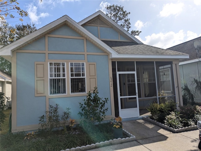 view of front facade with a sunroom