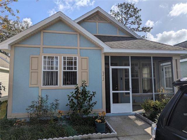 view of front of property with a sunroom