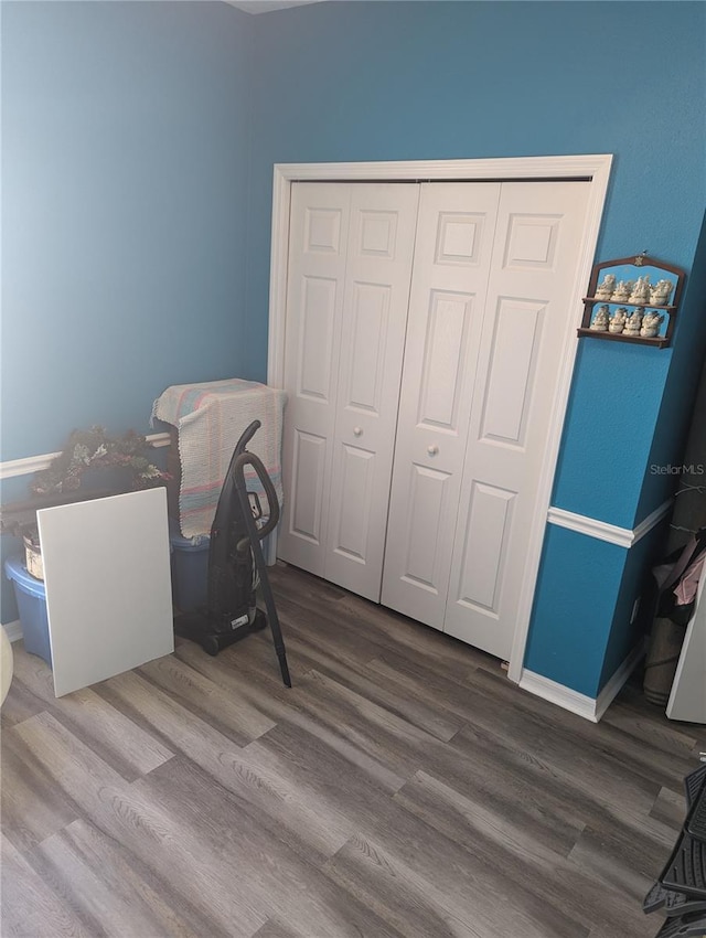 bedroom featuring hardwood / wood-style flooring and a closet