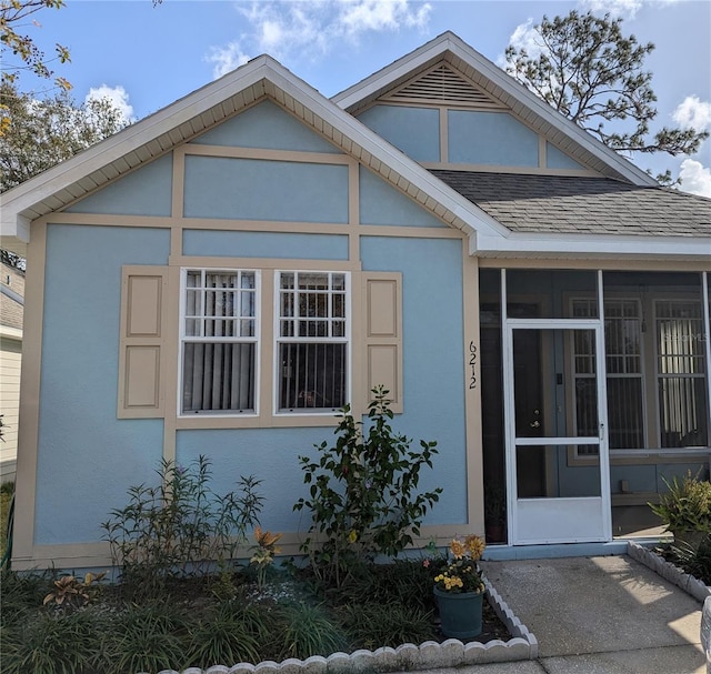 view of front of home with a sunroom