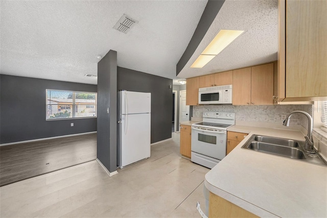 kitchen featuring decorative backsplash, light brown cabinetry, a textured ceiling, white appliances, and sink