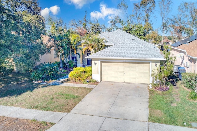 view of front of home with a garage and a front lawn