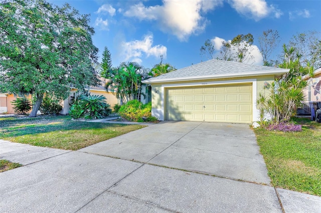 ranch-style home with a front lawn and a garage