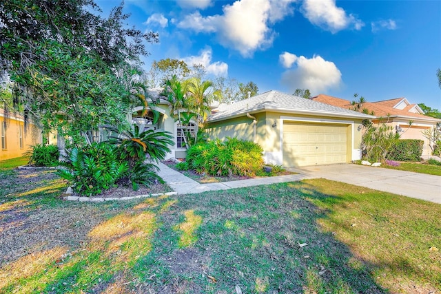 view of front of house with a garage and a front yard