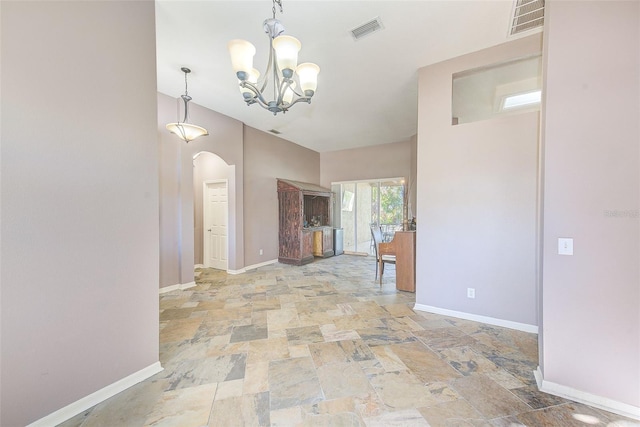 interior space featuring a notable chandelier