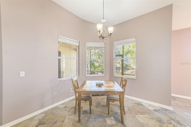 dining room with a notable chandelier