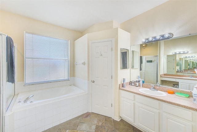 bathroom featuring plus walk in shower and vanity