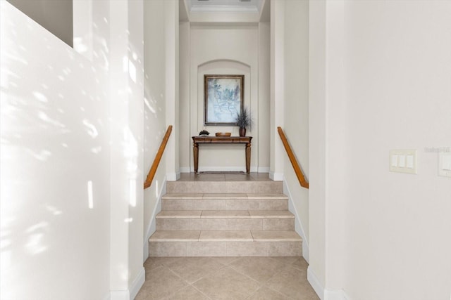 stairway featuring tile patterned flooring