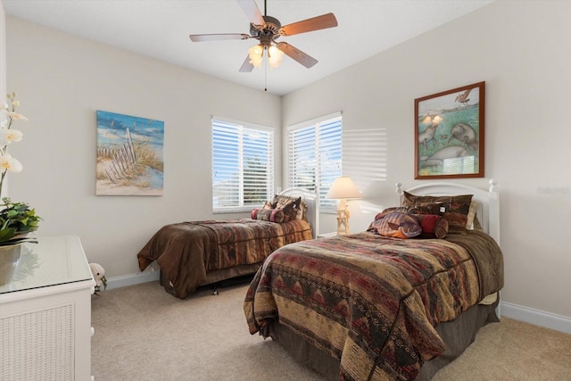 bedroom featuring light colored carpet and ceiling fan