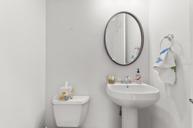 bathroom featuring sink and toilet