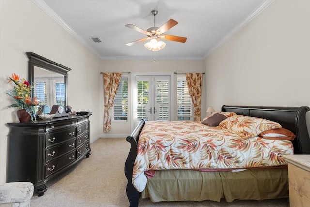 bedroom with ceiling fan, ornamental molding, light carpet, and french doors