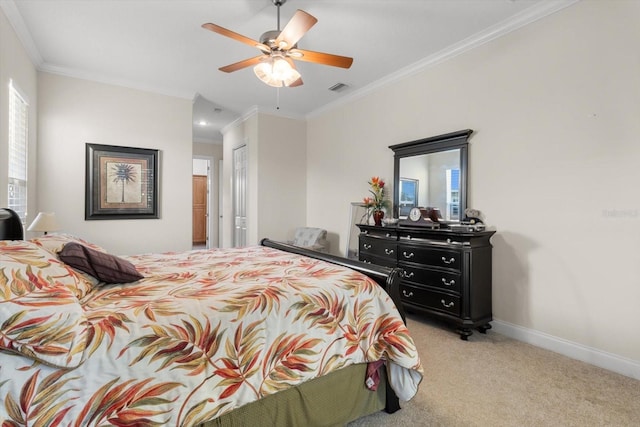 bedroom with ceiling fan, a closet, light carpet, and ornamental molding